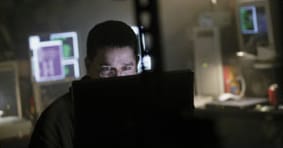 man looking at computer screen